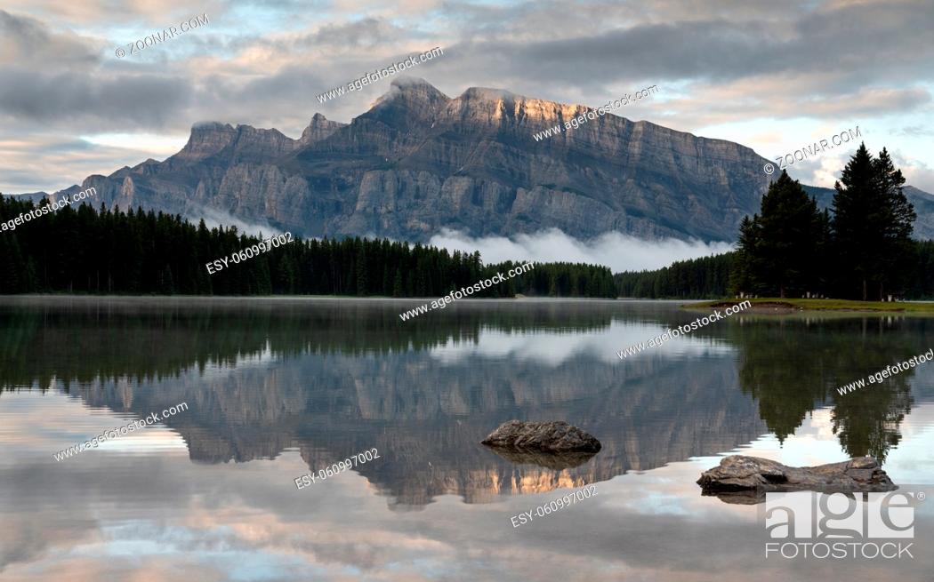 Stock Photo: Panoramic image of Mount Rundle reflecting in Two Jack Lake with early morning mood, Banff National Park, Alberta, Canada.