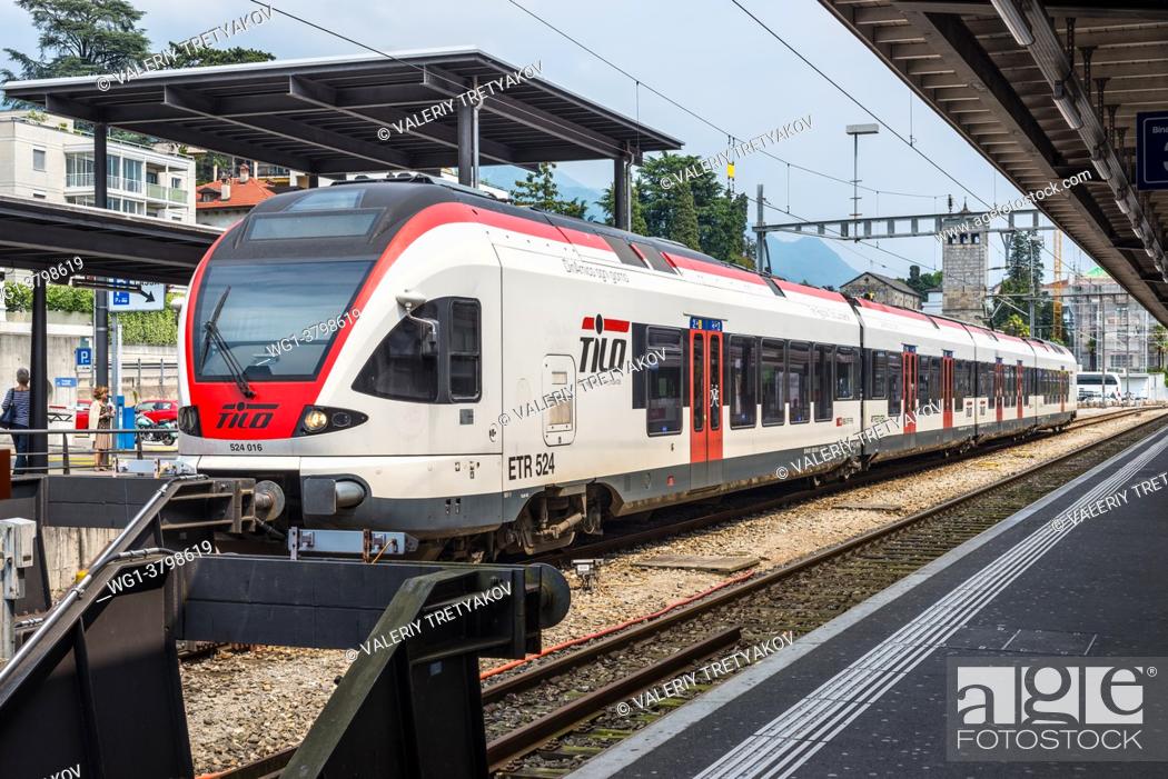 Stock Photo: Bellinzona, Switzerland A passenger train of the TILO (Regional Train Ticino Lombardia) at a platform of the Bellinzona railway station.