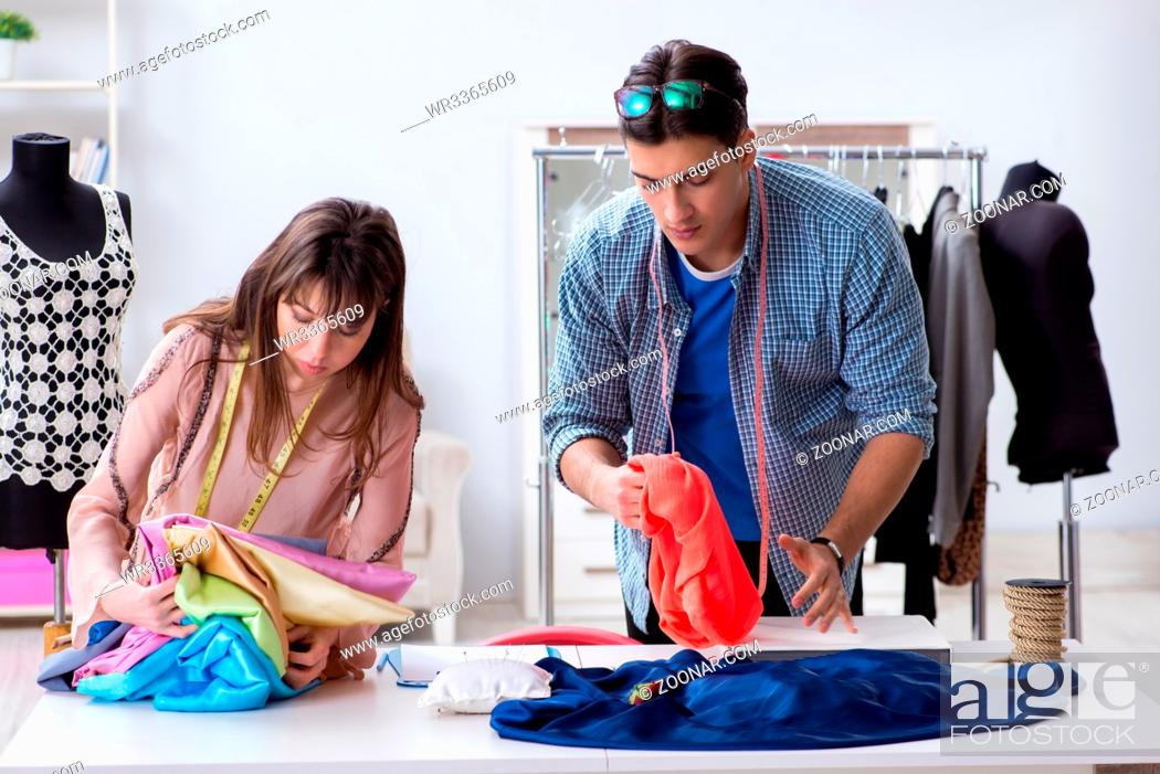 Stock Photo: Male tailor with female student in workshop.