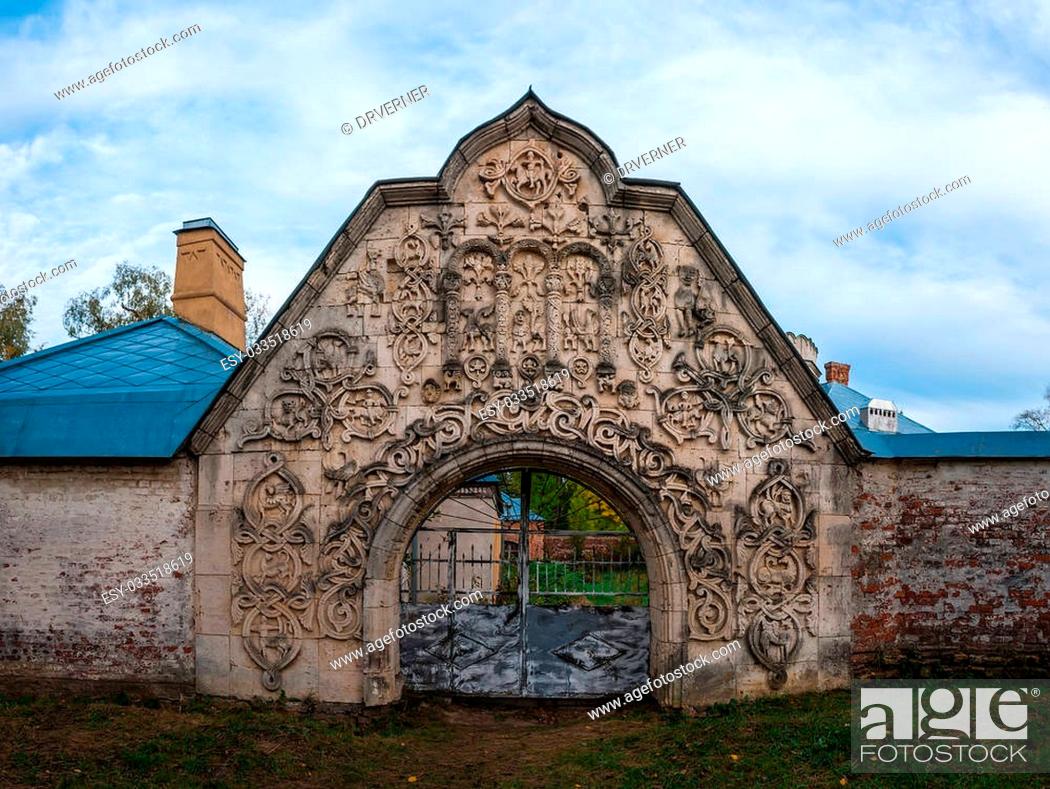 Stock Photo: Large arched gate in an abandoned medieval manor. Photographed in the town of Pushkin, Leningrad district, Russia.