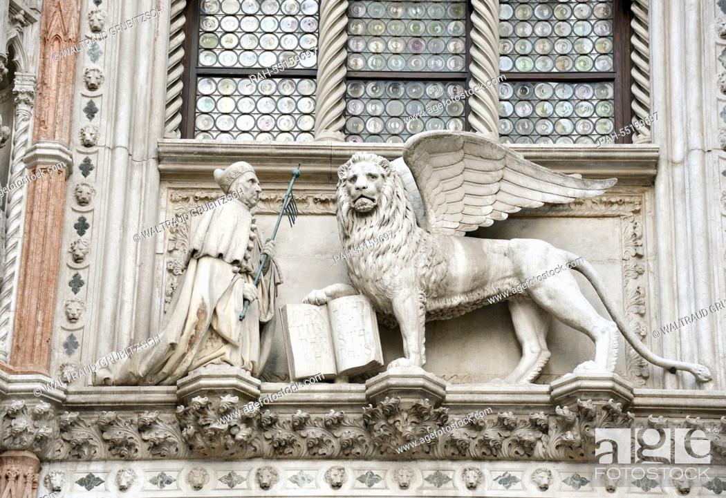 Stock Photo: the Doge Francesco Fascari, kneeling before a winged-lion, can be seen above the door at a side entrance to Doge's Palace, the Porta della Carta, in Venice.