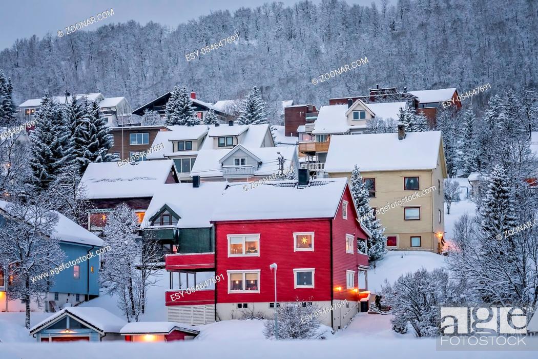 Stock Photo: Residential hillside houses in Tromso suburb covered in a deep snow in winter, northern Norway.