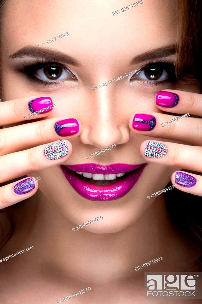 Beautiful girl with a bright evening make-up and purple manicure with  rhinestones, Stock Photo, Picture And Low Budget Royalty Free Image. Pic.  ESY-036718983 | agefotostock