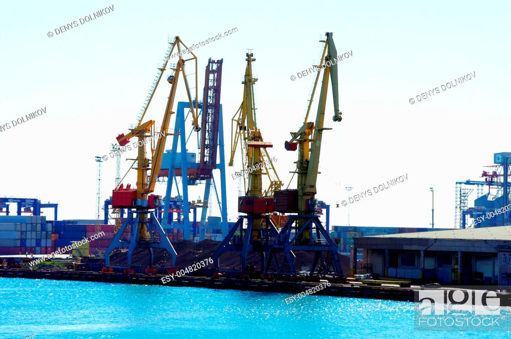Stock Photo: View on seaport with cranes at day.
