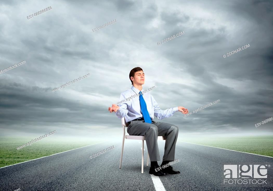 Stock Photo: businessman sitting on an office chair, meditation and calmness.
