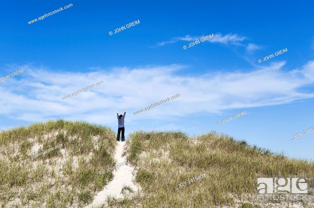 Stock Photo: Woman affirms the new day, Dennis, Cape Cod, Massachusetts, USA.