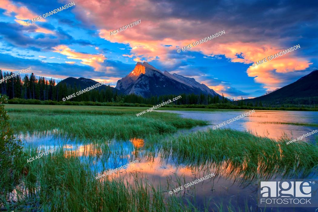 Stock Photo: Clouds and Mt. Rundle reflected in Vermillion Lakes at sunrise Banff National Park Alberta Canada.