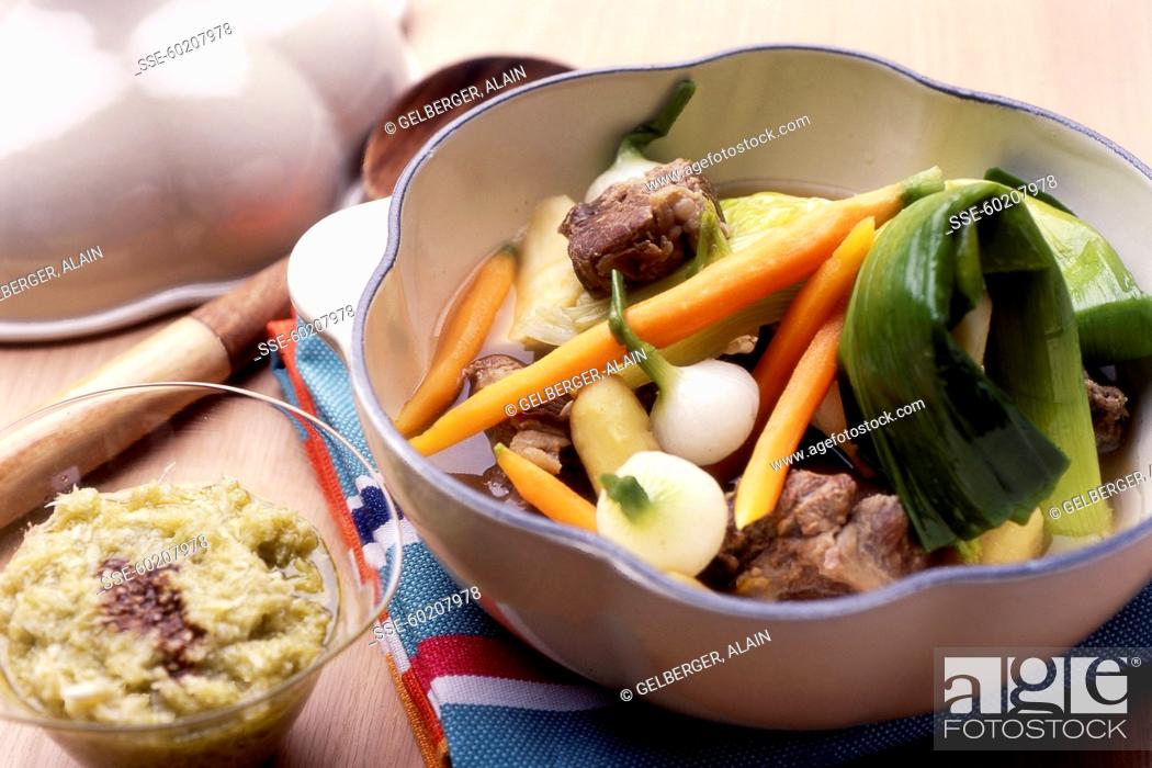 Stock Photo: Pot-au-feu and a bowl of garlic mash.