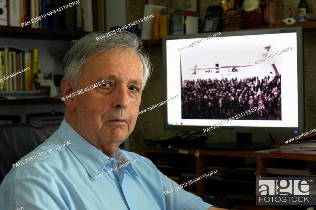 Stock Photo: 02 August 2022, Brandenburg, Wildau: Jörn Lehweß-Litzmann sits in his office in front of a computer display showing the so-called commissioning of the IL-62.