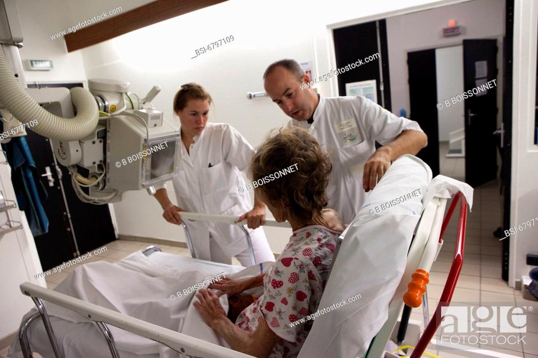 Stock Photo: Photo essay at the hospital of Meaux, France. Department of medical imagery. Operators with a patient.