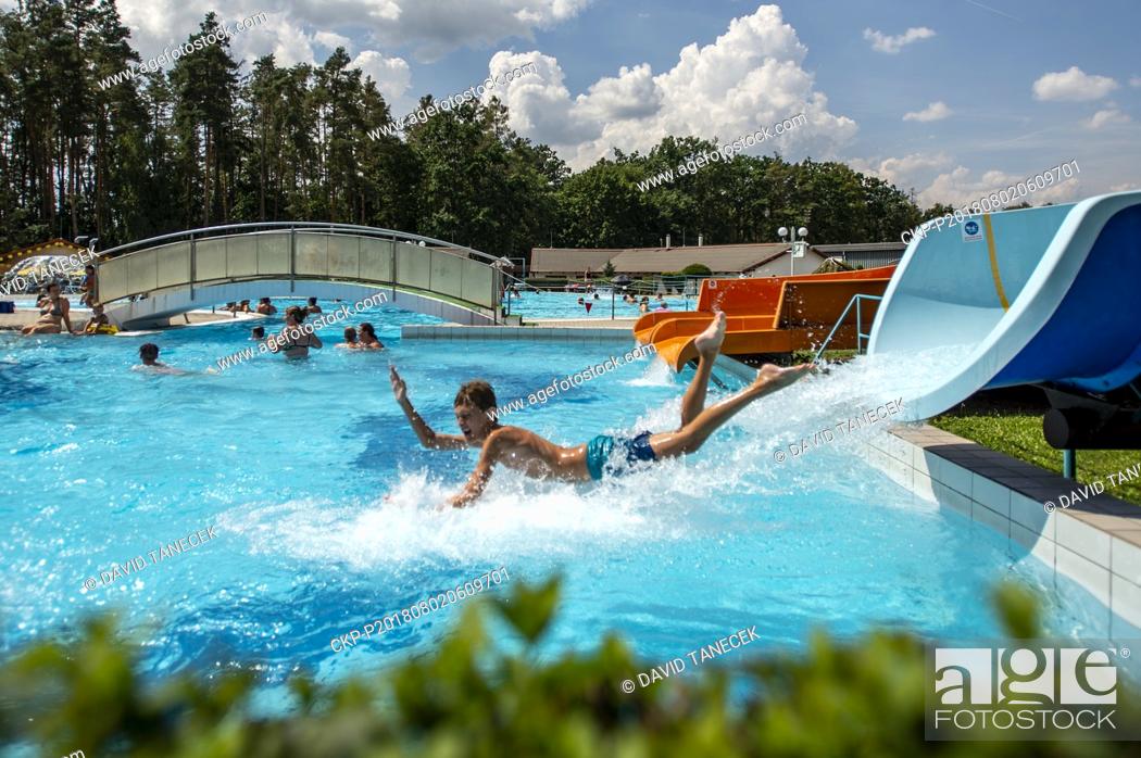 Stock Photo: The series of tropical days continues in the Czech Republic with temperatures of up to 38 degrees Centigrade and people enjoy sun bathing and swimming in.