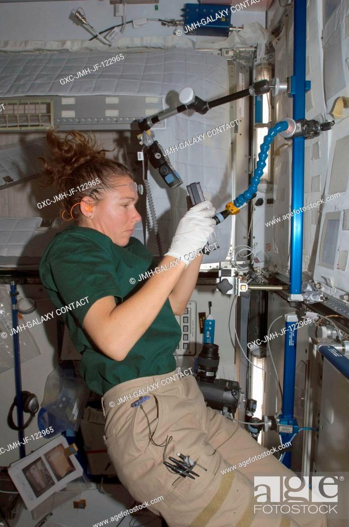 Stock Photo: Astronaut Sandra Magnus, Expedition 18 flight engineer, works in the Harmony node of the International Space Station.