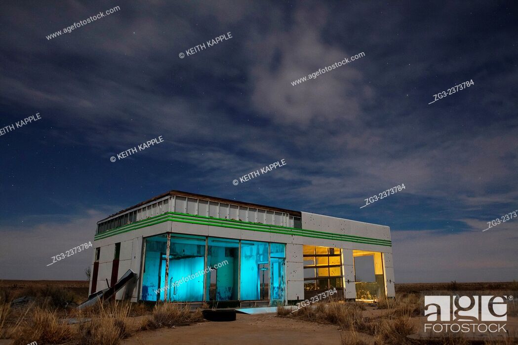 Stock Photo: Abandoned Old retro gas station at night, west Texas, USA.