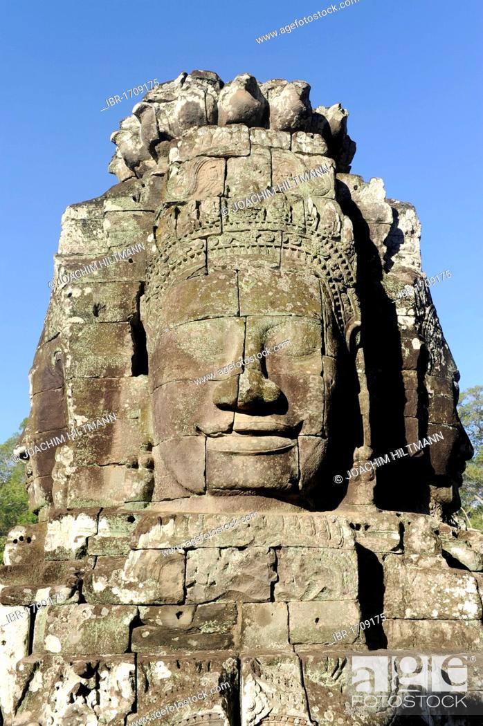 Stock Photo: Carved stone face of Bodhisattva Lokeshvara over the south gate of Angkor Thom, Angkor, UNESCO World Heritage Site, Siem Reap, Cambodia, Southeast Asia, Asia.