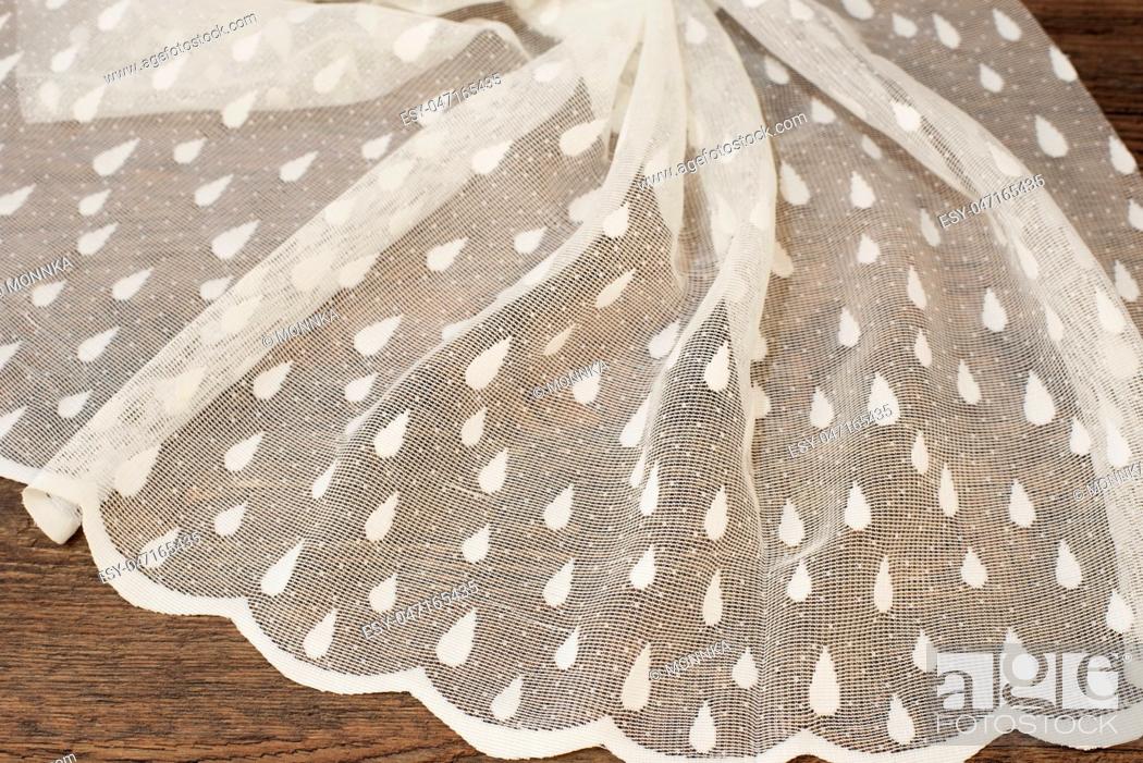 Stock Photo: Close up of Beautiful White Tulle. Sheer Curtains Fabric Sample. Texture, Background, Pattern. Wedding Concept. Interior Design.