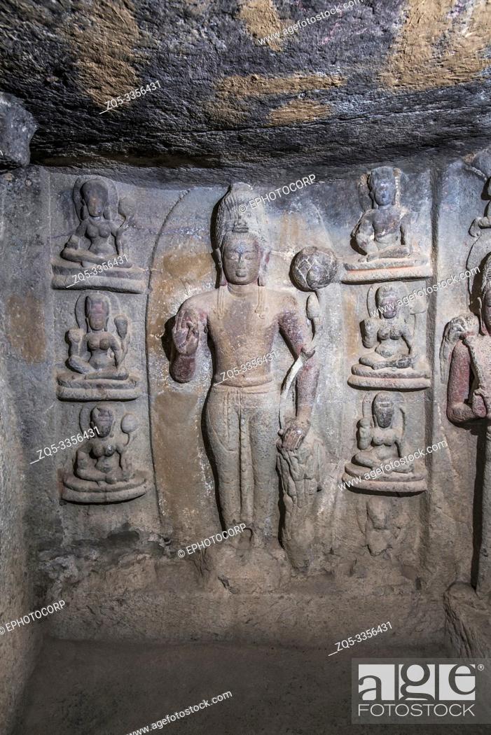 Stock Photo: Cave 23, Left wall showing Bodhisattva Padmapani holdling a lotus in left hand with six female figures, Nasik, Maharashtra.