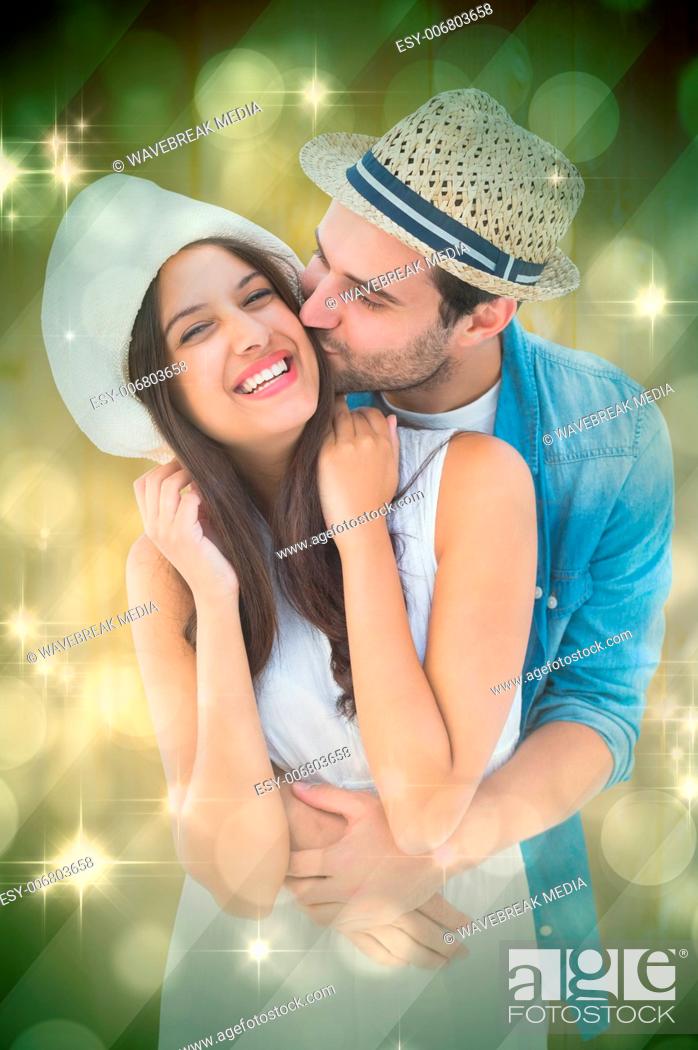Stock Photo: Composite image of happy hipster couple hugging and smiling.