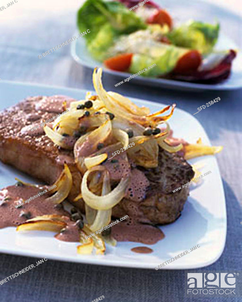 Stock Photo: Roast beef with onions and capers.