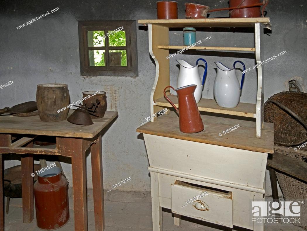 Stock Photo: interior view from an old kitchen in a cottage farmhouse room with table and cupboard in the flower park Mozirski Gaj in the town Mozirje in the in the valley.