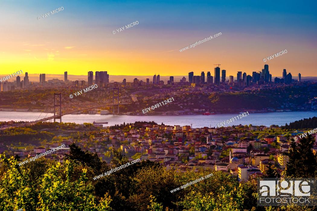 Stock Photo: Cityscape of Istanbul with Bosphorus, skyscrapers, and 15th July Martyrs Bridge Bosphorus Bridge from Camlica hill at sunset Istanbul, Turkey.