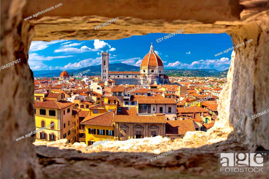 Stock Photo: Florence square and cathedral di Santa Maria del Fiore or Duomo view through stone window, Tuscany region of Italy.