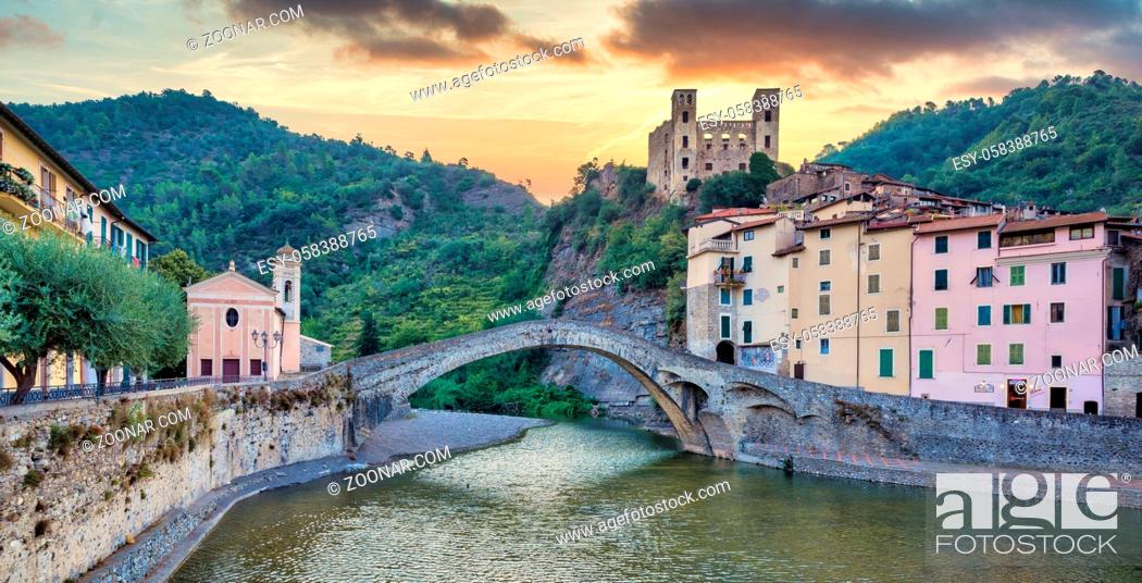 Stock Photo: DOLCEACQUA, ITALY - CIRCA AUGUST 2020: Dolceacqua panorama with the ancient roman bridge made of stones and the castle.
