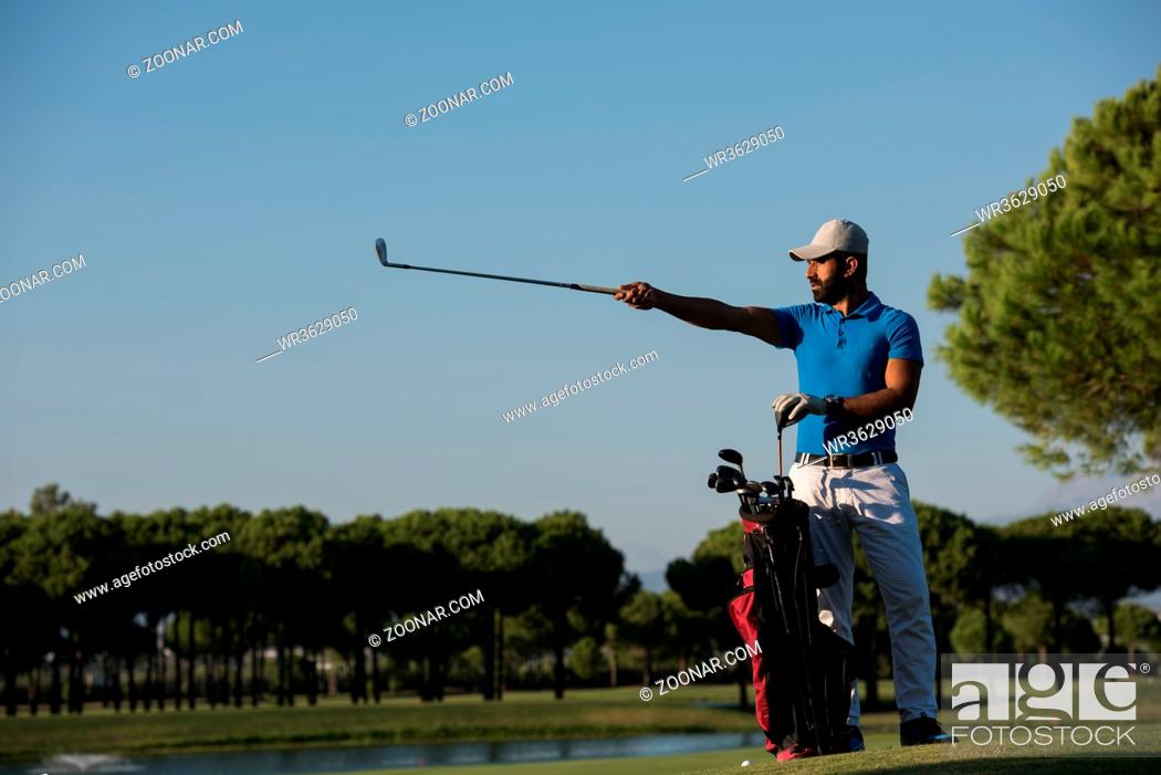 Stock Photo: handsome middle eastern golf player portrait at course at sunny day.