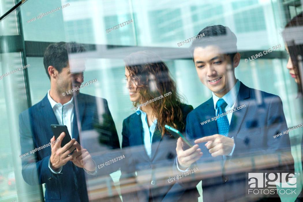Stock Photo: Group of business people use of cellphone.