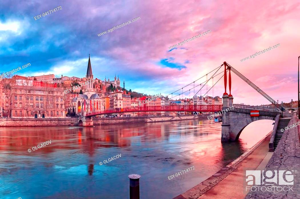 Stock Photo: Saint Georges church and footbridge across Saone river, Old town with Fourviere cathedral at gorgeous sunset in Lyon, France.