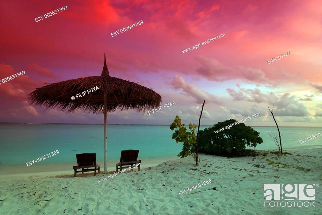 Stock Photo: Umbrella and sunset.