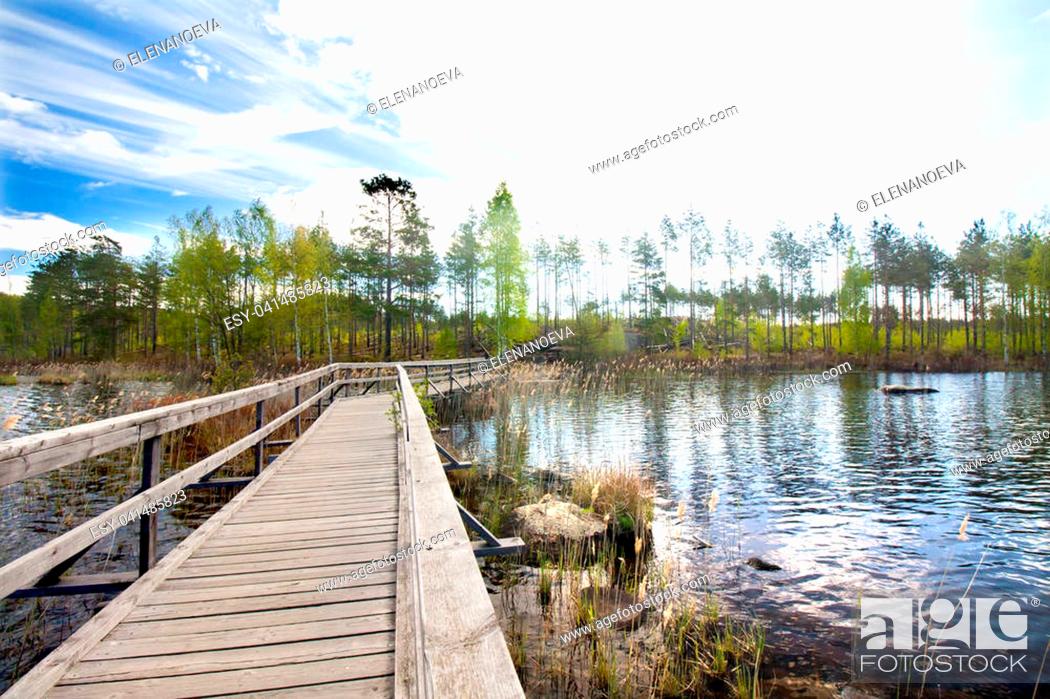 Stock Photo: Wooden pier on beautiful lake in the national park Repovesi, Finland, South Karelia.