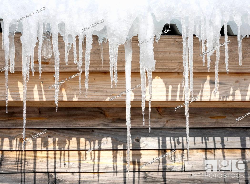 Stock Photo: Icicles on a roof.
