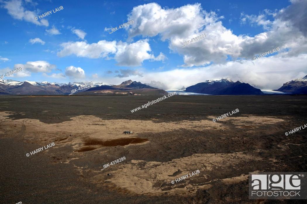 Stock Photo: Vulcanic sand Skeidararsandur at Skaftfell, behind mountains and glaciers Vatnakökull, Southern Region, Iceland.
