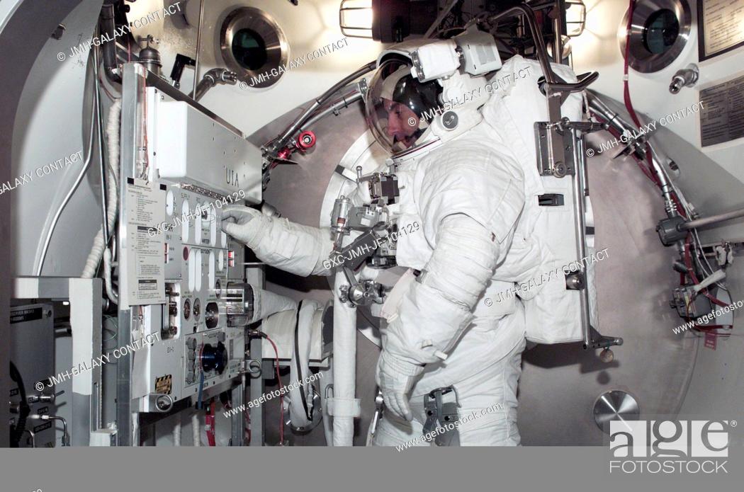 Stock Photo: Astronaut Philippe Perrin, STS-111 mission specialist representing CNES, the French Space Agency, is photographed during an Extravehicular Mobility Unit (EMU).