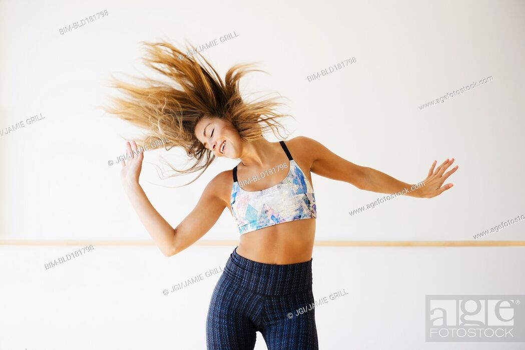 Stock Photo: Mixed race dancer practicing in studio.