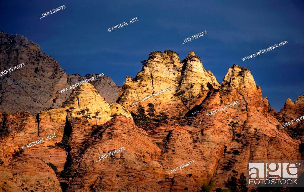 Stock Photo: The sun sets on the sandstone rock formations at the Kolob Terrace area of Zion National Park, Utah.