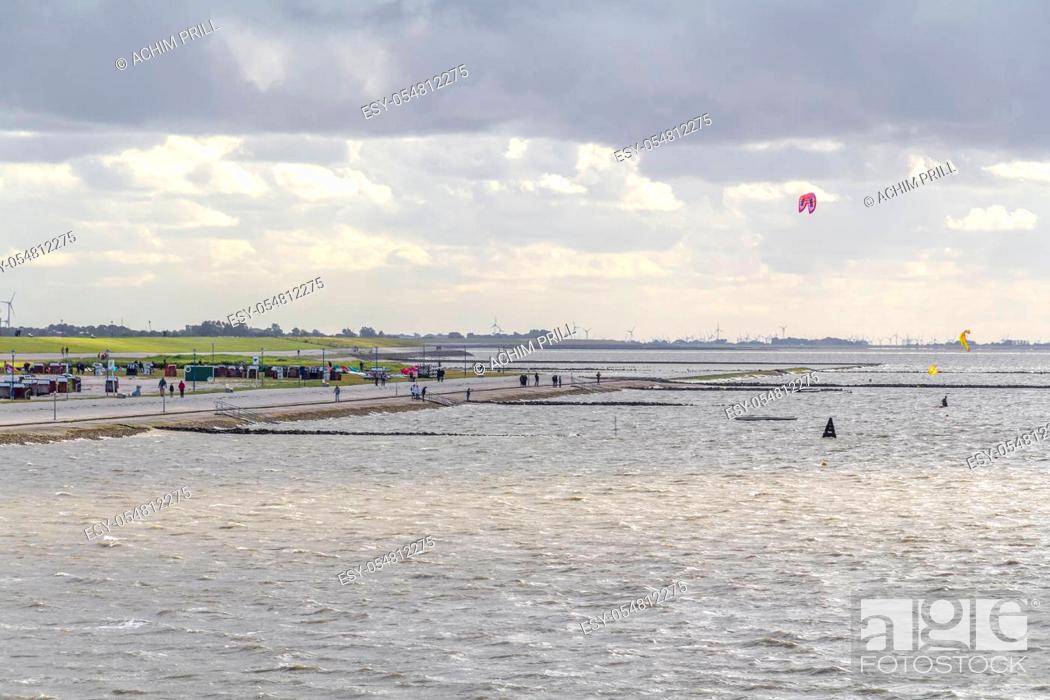 Stock Photo: coastal scenery including some kitesurfers near Neuharlingersiel in Eastern Frisia, Germany.
