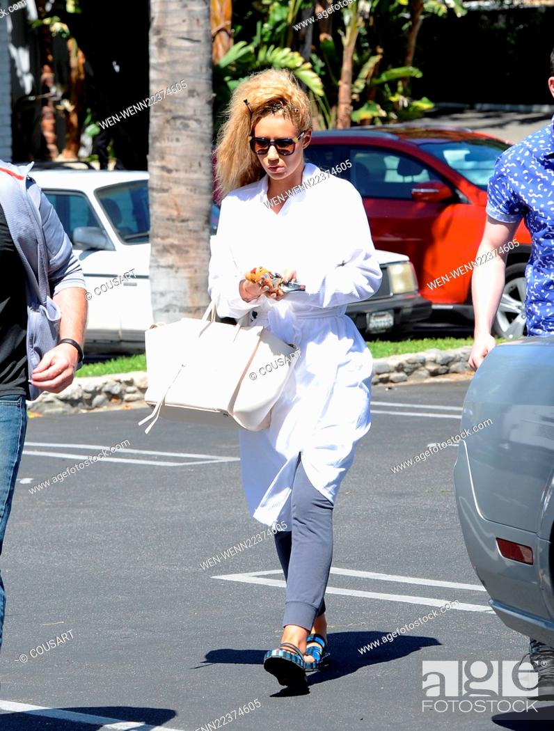 Stock Photo: Iggy Azalea leaves the set of her new music video 'Pretty Girls' wearing a bathrobe, after a day of filming in Studio City Featuring: Iggy Azalea Where: Los.