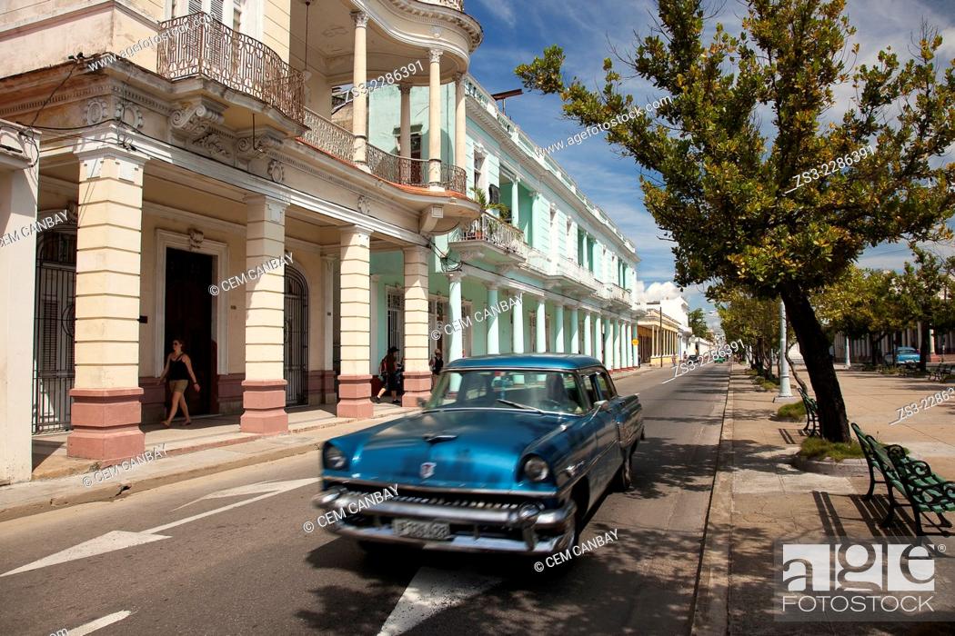 Stock Photo: Old american car in the main avenue Prado at town center, Cienfuegos, Cienfuegos Province, Cuba, West Indies, Central America.