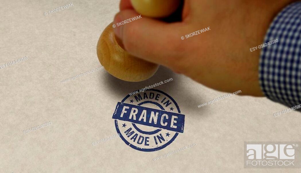 Imagen: Made in France stamp and stamping hand. Factory, manufacturing and production country concept.