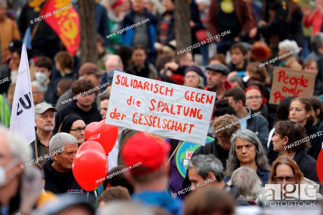 Stock Photo: 22 October 2022, Berlin: A banner reading ""Solidarity against the division of society"" is seen in Invalidenpark during a demonstration.