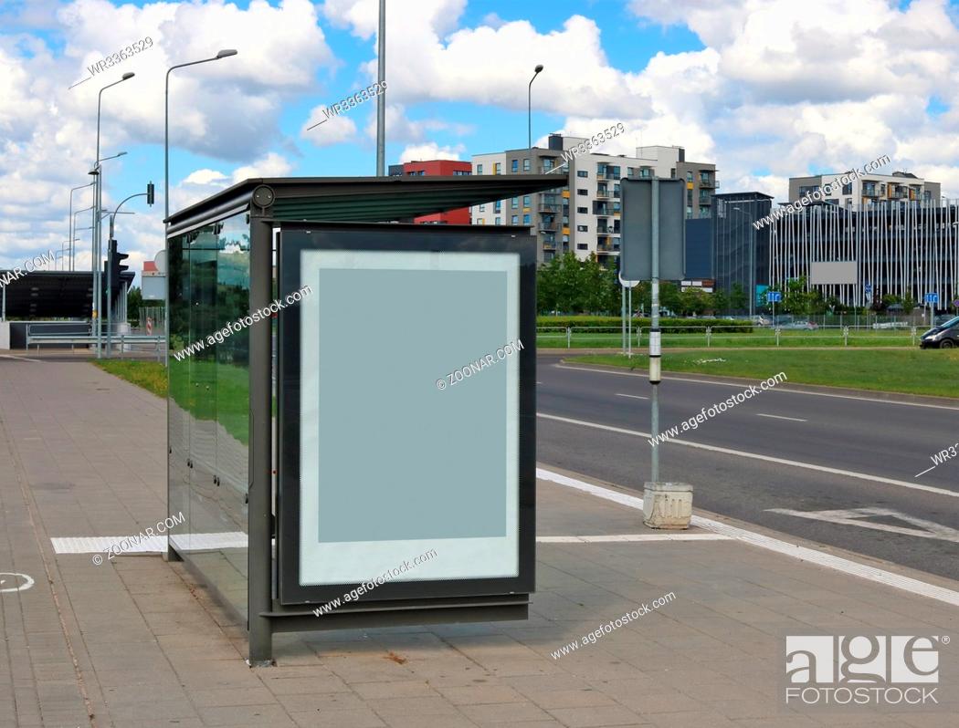 Photo de stock: The empty mass production bus-stop near highway in the small european city.
