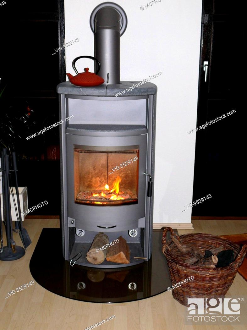 Stock Photo: living room and wood burning fireplace insert - 01/01/2013.