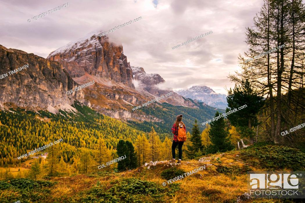 Stock Photo: Hiker enjoying scenery, Mount Lagazuoi, Dolomite Alps, South Tyrol, Italy.