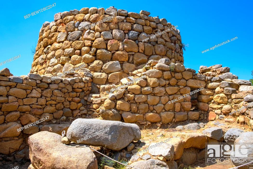 Imagen: Arzachena, Sardinia / Italy - 2019/07/19: Archeological ruins of Nuragic complex La Prisgiona - Nuraghe La Prisgiona - with stone main tower and preserved.