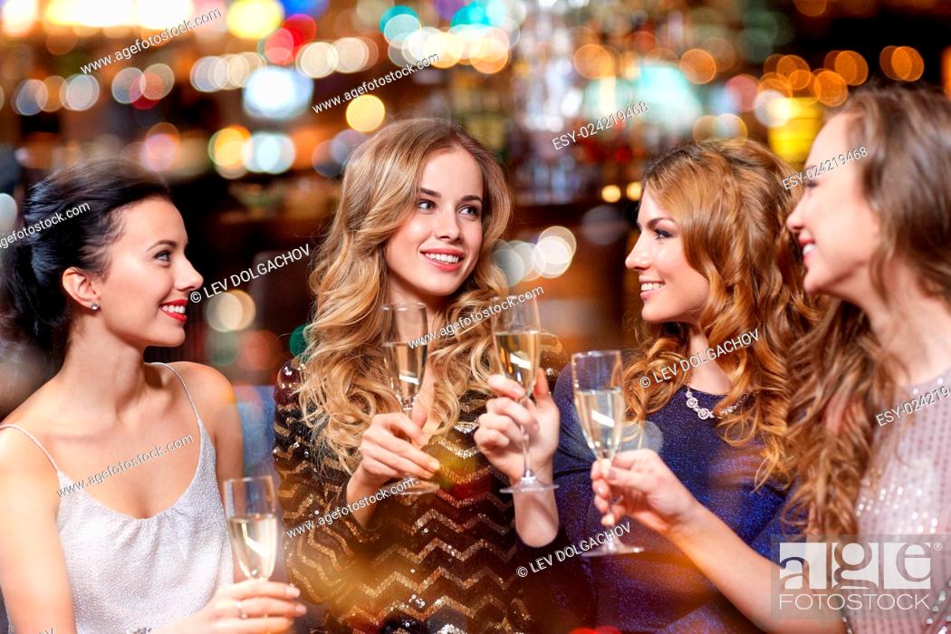 Stock Photo: celebration, friends, bachelorette party and holidays concept - happy women with champagne glasses at night club.