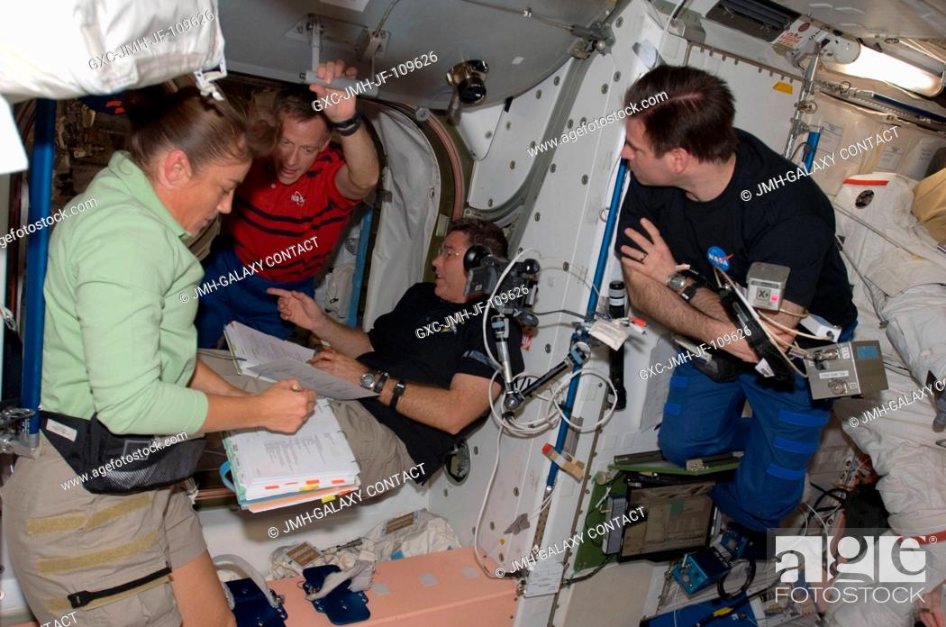 Stock Photo: Astronauts Heidemarie Stefanyshyn-Piper, STS-126 mission specialist; Chris Ferguson (left background), commander; Steve Bowen and Greg Chamitoff.