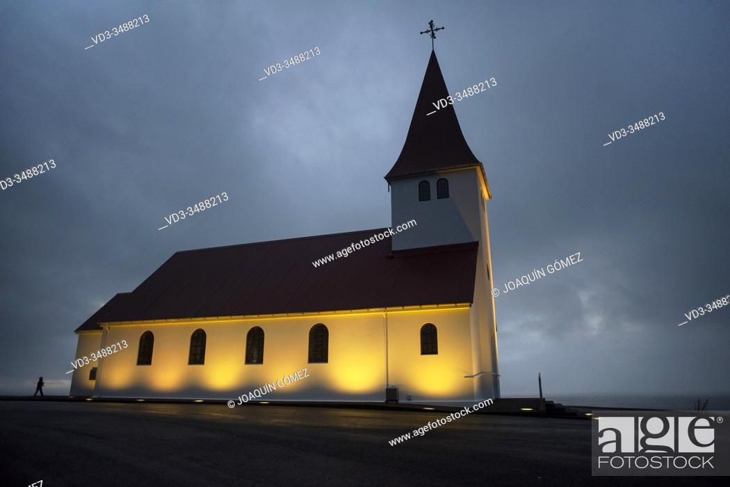 Stock Photo: Sunrise view of the church of Vík (vikurkirkja), built in the 1930s, rises above the town of Vík in southern Iceland.