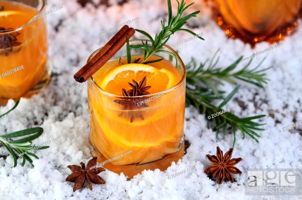 Stock Photo: Negroni cocktail. Bourbon with cinnamon with oranges juice and star anise.The perfect cozy cocktail for chilly December evenings.