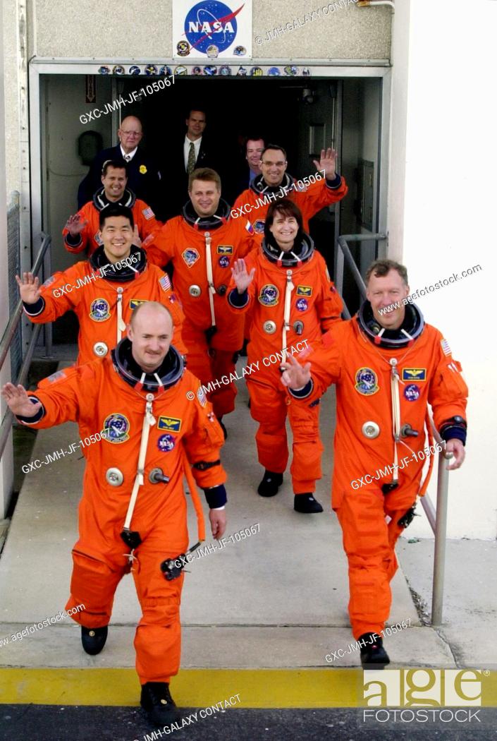 Stock Photo: KENNEDY SPACE CENTER, Fla. -- Eagerly stepping out from the Operations and Checkout Building are the STS-108 crew, leading the way.